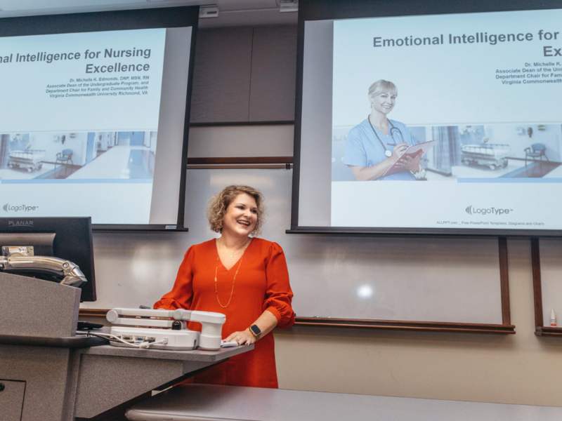 michelle edmonds addresses a lecture hall of students
