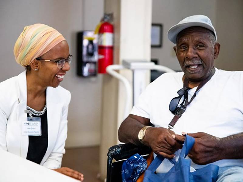 Assistant Professor Ana Diallo, Ph.D., of the VCU Department of Family and Community Health Nursing, works with Richmond Health and Wellness Program participant Leslie Harris.