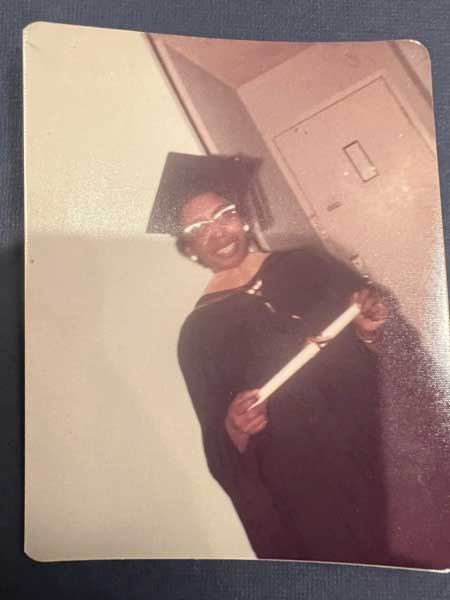 charlotte anne wynn pollard in a graduation cap and gown