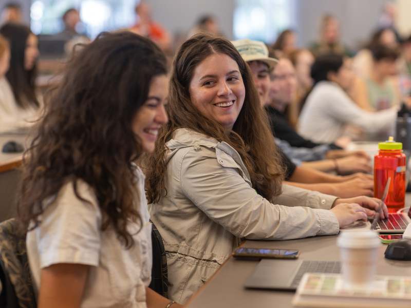 students smile during a class lecture